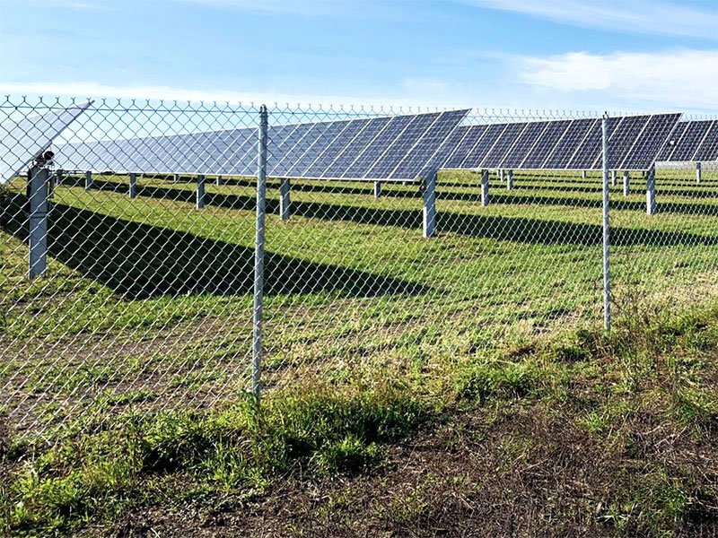 Strings of solar panels - Installation of OPTIFENCE perimeter security system in solar power plant