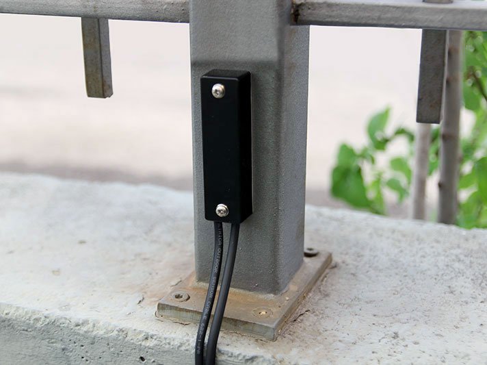 Close-up of flex sensor installed on metal railing post