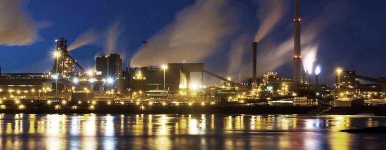 Refinery facility photographed at dusk