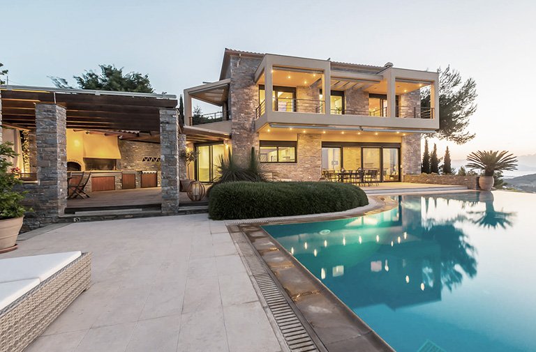 Swimming pool and barbecue area in high-end residential property's courtyard